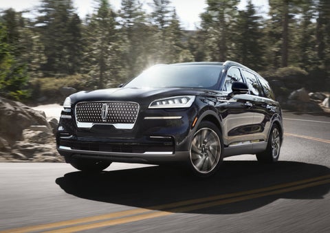 A Lincoln Aviator® SUV is being driven on a winding mountain road | Courtesy Lincoln in Altoona PA