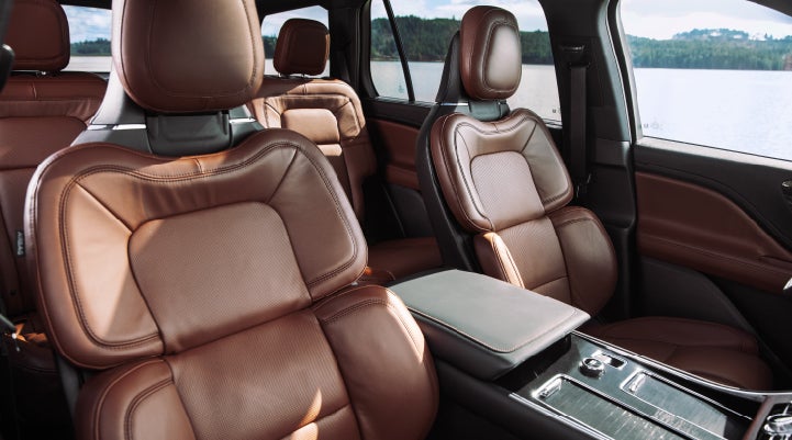 The front row's Perfect Position Seats in a 2024 Lincoln Aviator® Reserve model with Ebony Roast interior | Courtesy Lincoln in Altoona PA
