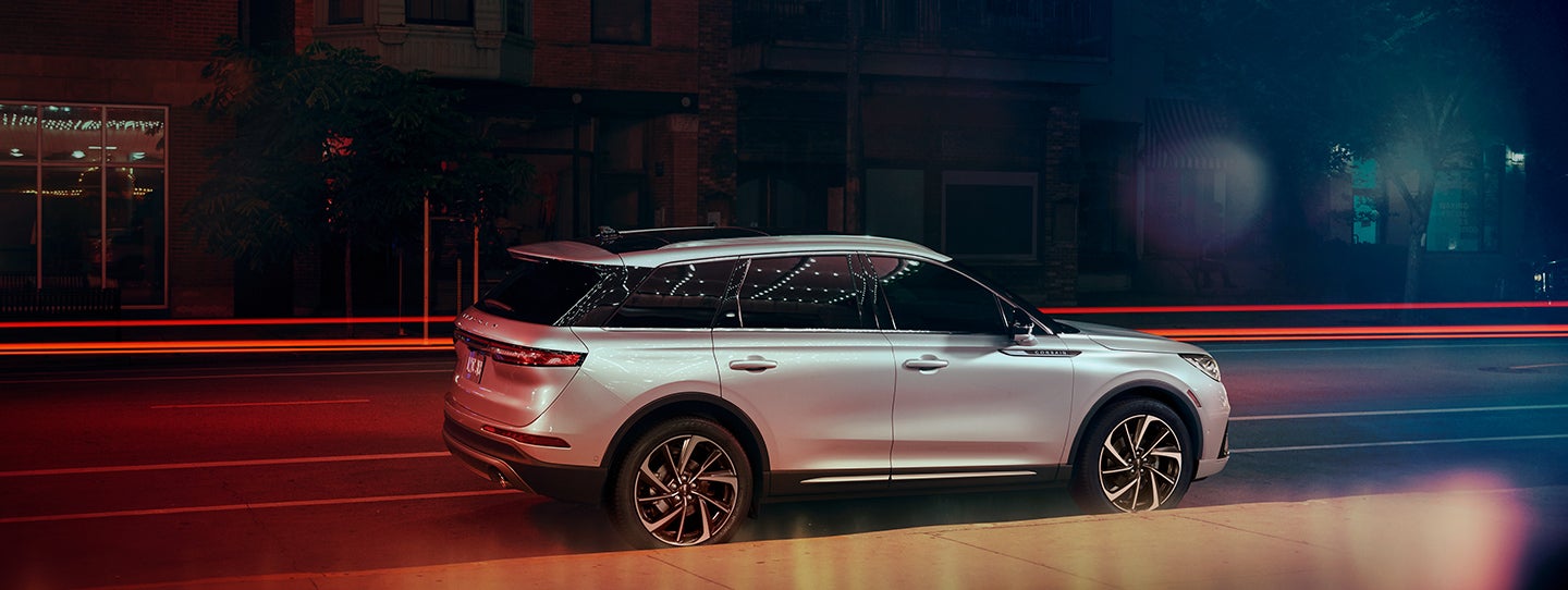 The 2024 Lincoln Corsair® SUV is parked on a city street at night. | Courtesy Lincoln in Altoona PA